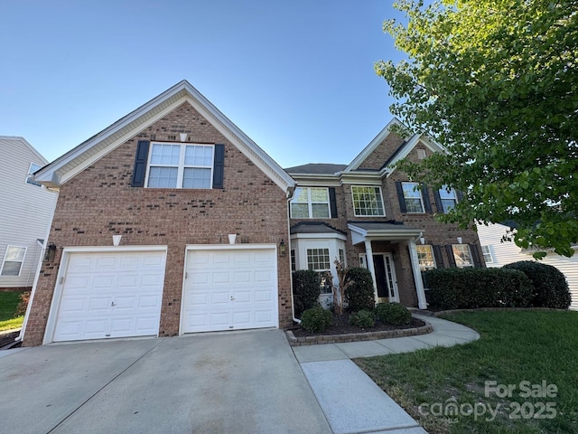 7925 Woodmere Dr, Harrisburg, NC 28075 - view of front of property with concrete driveway, brick siding, and an attached garage