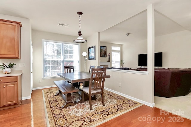 7925 Woodmere Dr, Harrisburg, NC 28075 - dining space with light wood-type flooring and baseboards
