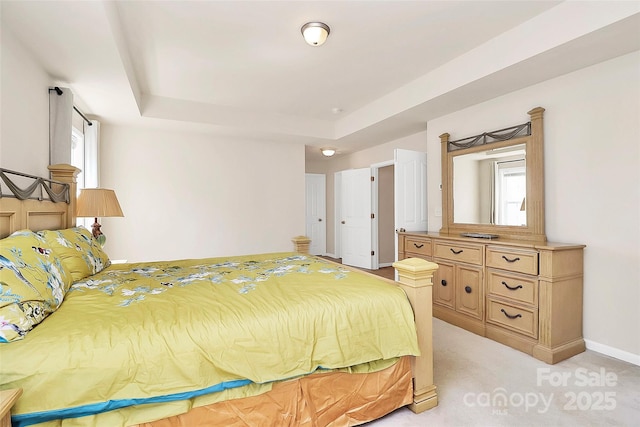 7925 Woodmere Dr, Harrisburg, NC 28075 - bedroom with a raised ceiling, light carpet, and baseboards