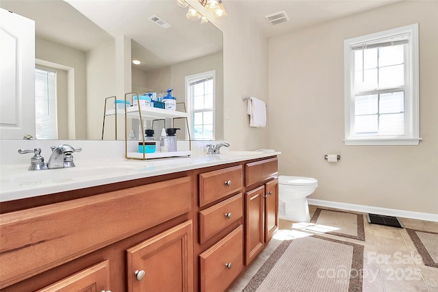 7925 Woodmere Dr, Harrisburg, NC 28075 - full bath featuring baseboards, walk in shower, double vanity, toilet, and tile patterned floors