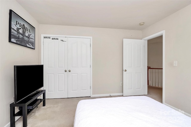7925 Woodmere Dr, Harrisburg, NC 28075 - bedroom featuring light carpet, a closet, and baseboards