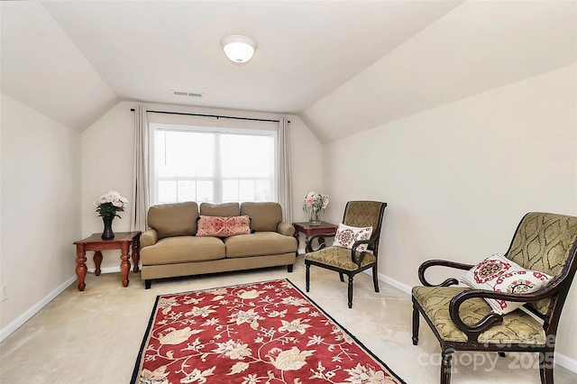 7925 Woodmere Dr, Harrisburg, NC 28075 - living area featuring light carpet, vaulted ceiling, and baseboards