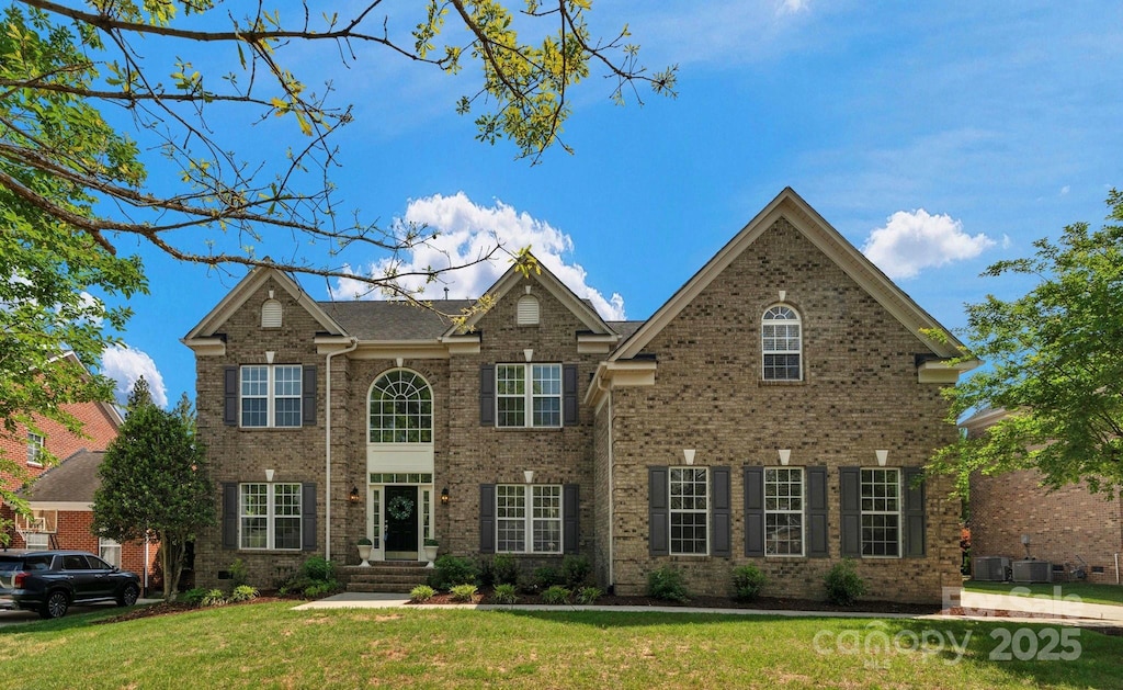 7605 Berryfield Ct, Waxhaw, NC 28173 - view of front facade featuring a front lawn and brick siding