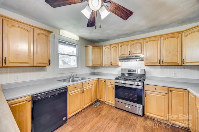 113 Hemphill Ave, Chester, SC 29706 - kitchen with a sink, dishwasher, light wood-type flooring, under cabinet range hood, and gas range