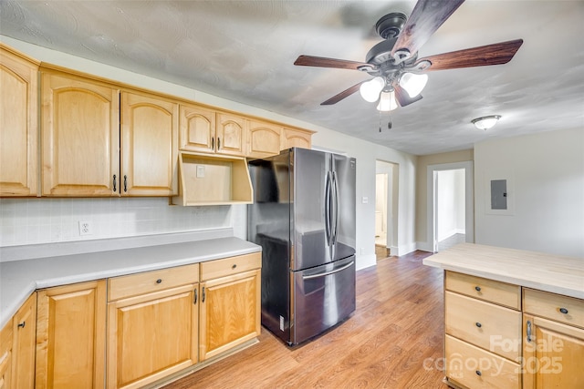 113 Hemphill Ave, Chester, SC 29706 - kitchen with light countertops, light brown cabinetry, ceiling fan, freestanding refrigerator, and light wood-style flooring