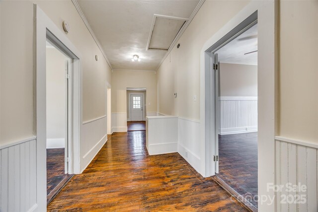 113 Hemphill Ave, Chester, SC 29706 - hall featuring a wainscoted wall, ornamental molding, dark wood-style floors, and attic access