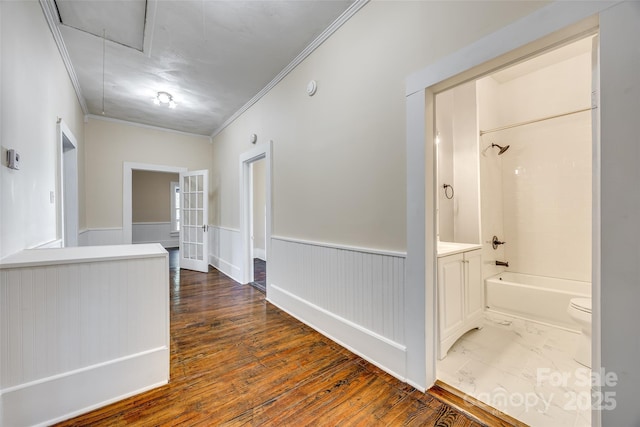 113 Hemphill Ave, Chester, SC 29706 - corridor with wood finished floors, crown molding, attic access, and wainscoting