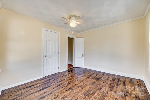 113 Hemphill Ave, Chester, SC 29706 - empty room with dark wood finished floors, crown molding, baseboards, and ceiling fan