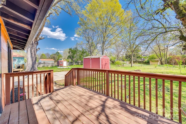 113 Hemphill Ave, Chester, SC 29706 - wooden terrace featuring a lawn, a storage unit, a fenced backyard, and an outdoor structure