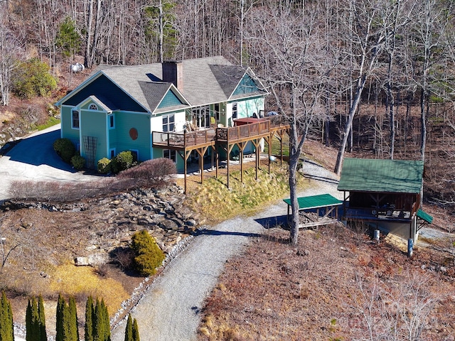 288 Hawks Point Dr, Zirconia, NC 28790 - back of property with a chimney, a wooden deck, and a forest view