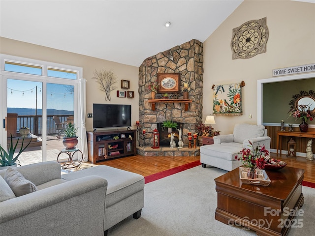 288 Hawks Point Dr, Zirconia, NC 28790 - living area with high vaulted ceiling, a fireplace, and wood finished floors