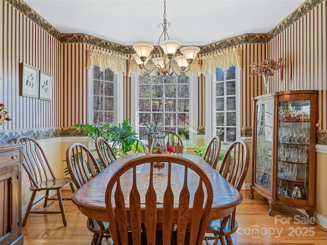 288 Hawks Point Dr, Zirconia, NC 28790 - dining room with light wood finished floors, baseboards, and a chandelier