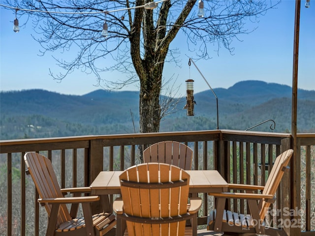 288 Hawks Point Dr, Zirconia, NC 28790 - deck with outdoor dining space and a mountain view