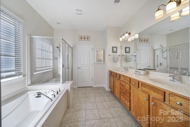 bathroom with a garden tub, double vanity, a sink, and a stall shower