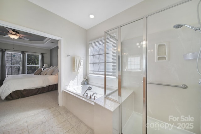 ensuite bathroom with a shower stall, a garden tub, ensuite bathroom, and a ceiling fan