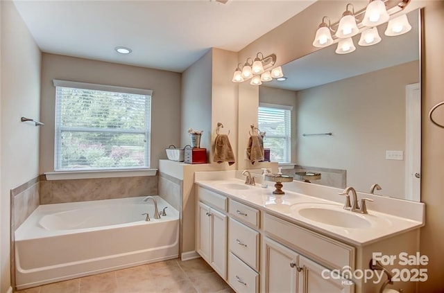 bathroom with a bath, tile patterned flooring, a sink, and double vanity
