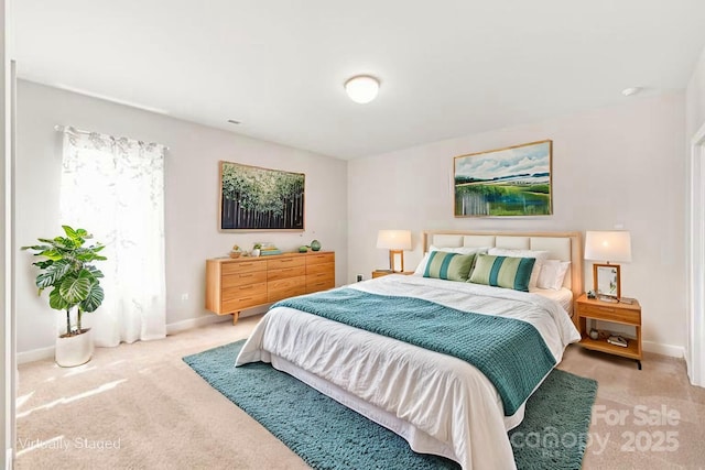 bedroom with carpet and baseboards