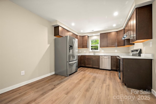 371 Amber Oaks Dr, Rutherfordton, NC 28139 - kitchen with appliances with stainless steel finishes, baseboards, light wood-type flooring, light countertops, and recessed lighting