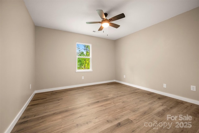 371 Amber Oaks Dr, Rutherfordton, NC 28139 - spare room with a ceiling fan, baseboards, and wood finished floors