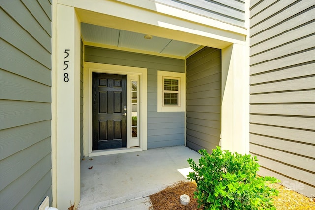 doorway to property featuring covered porch