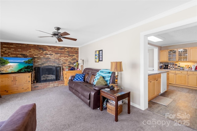 1912 Old W Ln, Gastonia, NC 28052 - living room with crown molding, a ceiling fan, light colored carpet, and a brick fireplace