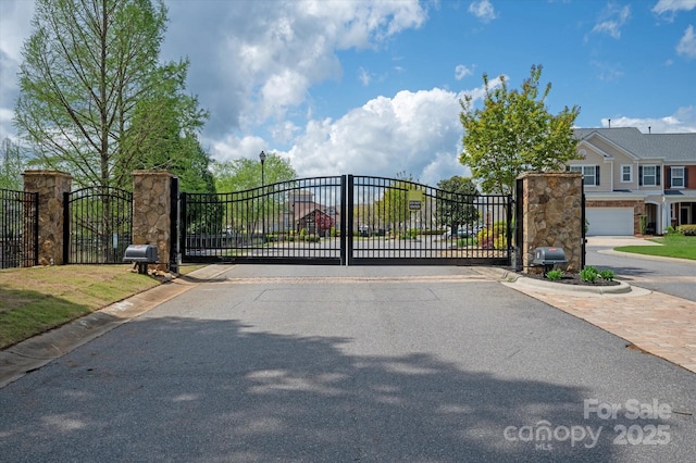 view of gate with fence