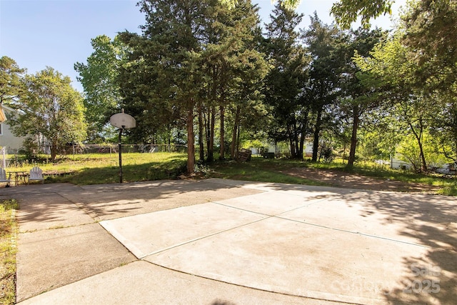 view of patio / terrace with fence and basketball court