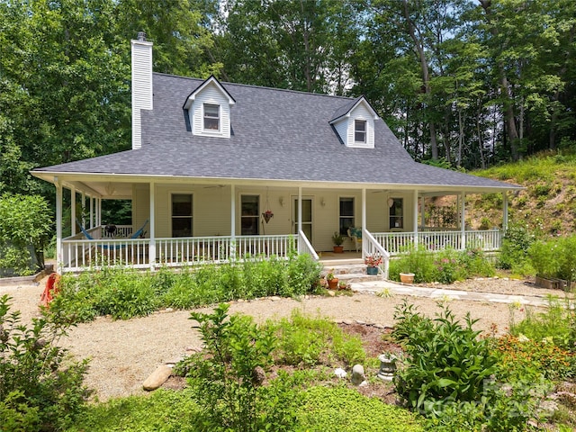 109 Paradise Cir, Clyde, NC 28721 - country-style home with covered porch, roof with shingles, and a chimney