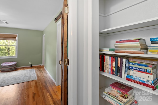 109 Paradise Cir, Clyde, NC 28721 - detailed view of wood finished floors and a barn door