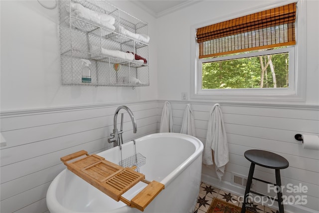 109 Paradise Cir, Clyde, NC 28721 - full bathroom featuring a freestanding tub, ornamental molding, and a wainscoted wall