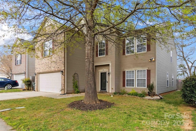 view of front of house featuring an attached garage, driveway, and a front yard