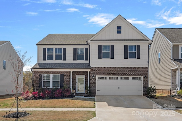 view of front facade with an attached garage, a front lawn, brick siding, board and batten siding, and concrete driveway