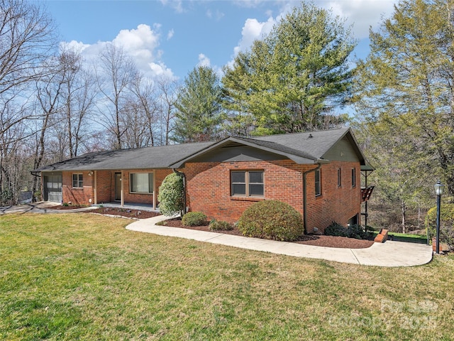 single story home with brick siding and a front lawn