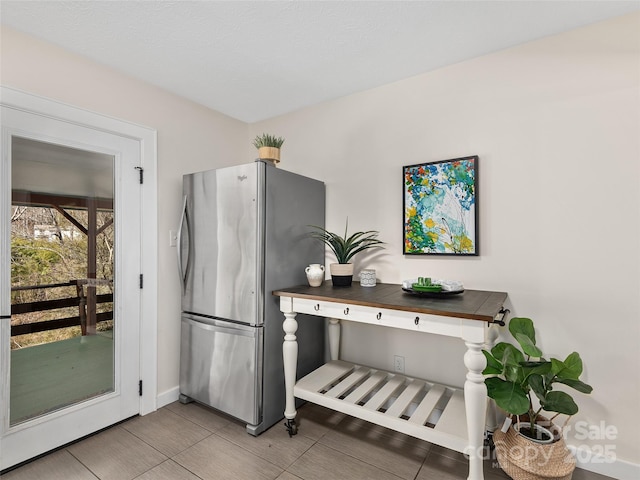 kitchen with freestanding refrigerator