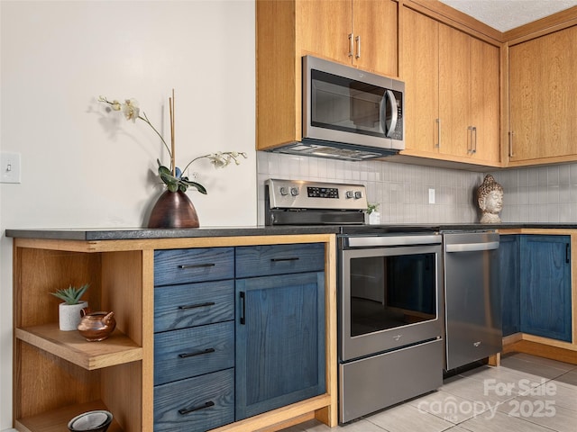 kitchen with blue cabinetry, backsplash, appliances with stainless steel finishes, and open shelves