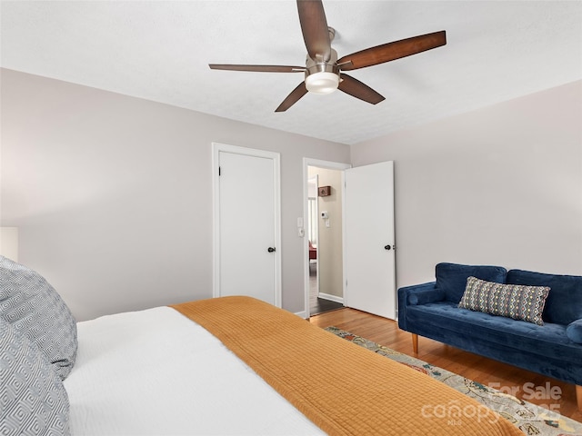 bedroom featuring wood finished floors and ceiling fan