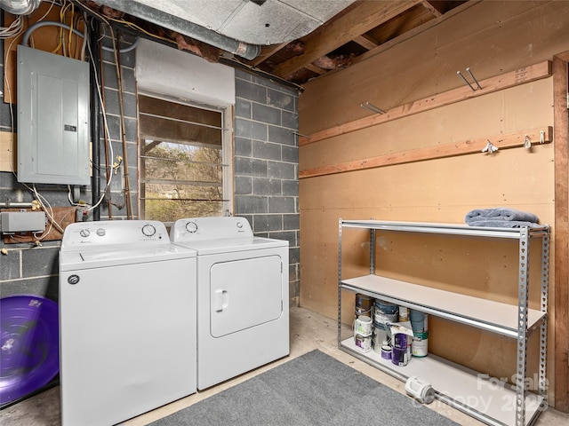 washroom with washer and dryer, laundry area, and electric panel