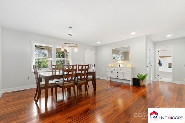 dining space featuring a chandelier, baseboards, recessed lighting, and dark wood-type flooring
