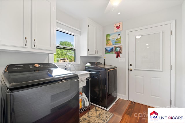 laundry area featuring independent washer and dryer, dark wood-type flooring, ceiling fan, and cabinet space