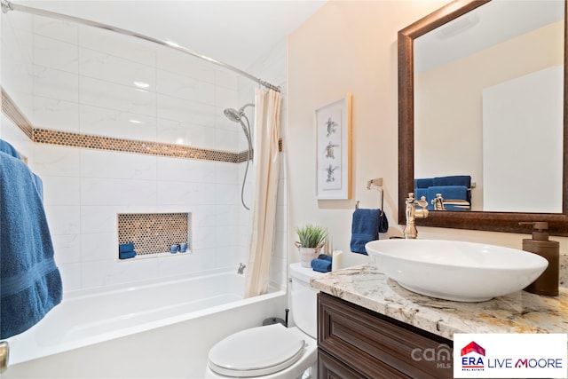 full bathroom with shower / bath combo with shower curtain, vanity, and toilet