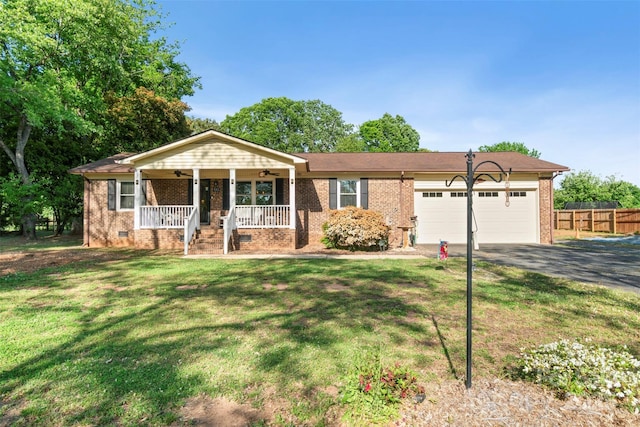 552 Odell School Rd, Concord, NC 28027 - ranch-style house with covered porch, a garage, driveway, brick siding, and a ceiling fan