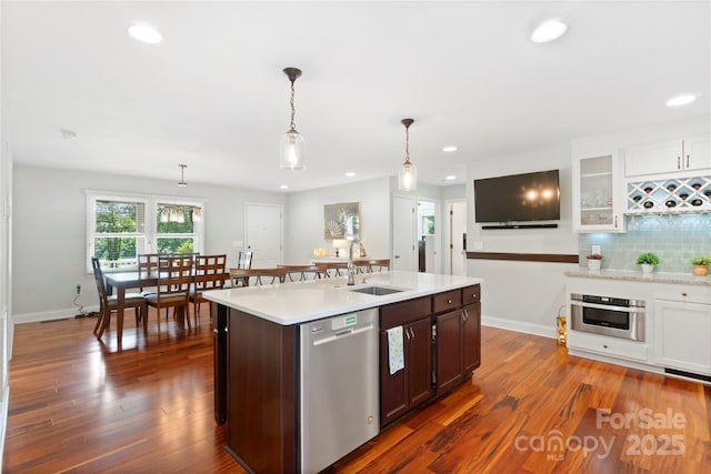 552 Odell School Rd, Concord, NC 28027 - kitchen with stainless steel appliances, a sink, light countertops, recessed lighting, and dark wood-style floors