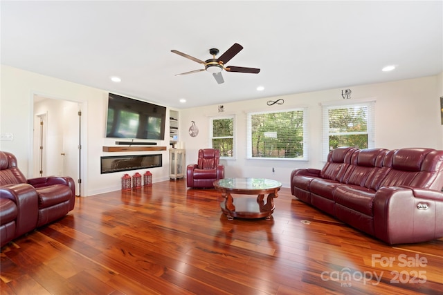 552 Odell School Rd, Concord, NC 28027 - living room featuring a ceiling fan, recessed lighting, wood-type flooring, and a glass covered fireplace