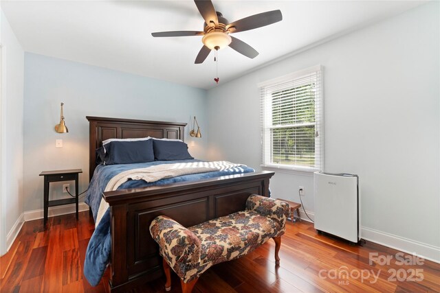 552 Odell School Rd, Concord, NC 28027 - bedroom featuring wood finished floors, baseboards, and a ceiling fan