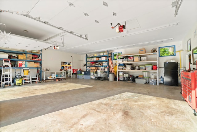 552 Odell School Rd, Concord, NC 28027 - garage with freestanding refrigerator and a garage door opener