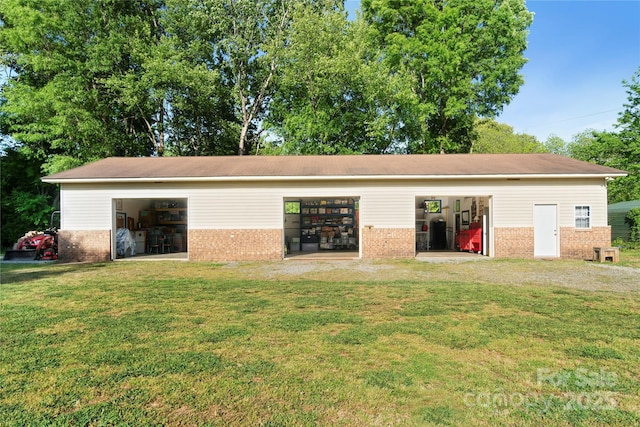 552 Odell School Rd, Concord, NC 28027 - back of house with brick siding, an outdoor structure, and a yard