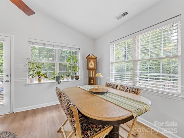 2214 Olde Chantilly Ct, Charlotte, NC 28205 - dining room with vaulted ceiling, light wood finished floors, and baseboards