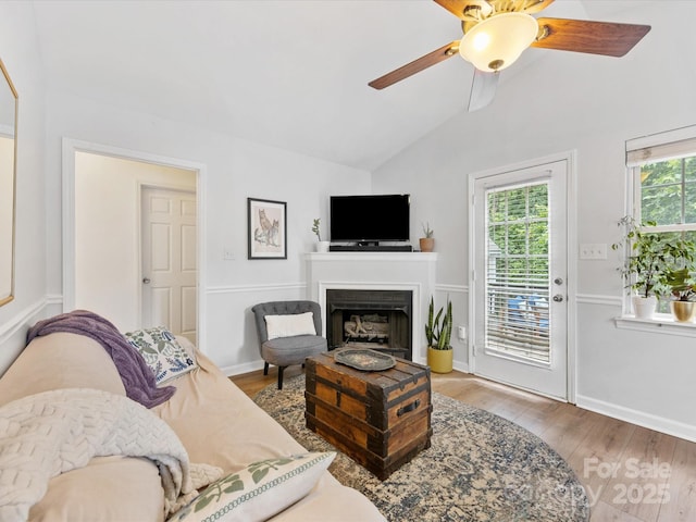2214 Olde Chantilly Ct, Charlotte, NC 28205 - living area with vaulted ceiling, ceiling fan, wood finished floors, a fireplace, and baseboards
