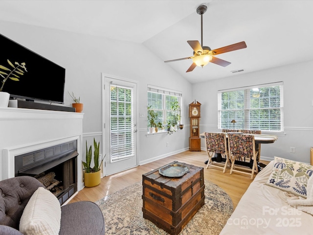 2214 Olde Chantilly Ct, Charlotte, NC 28205 - living area featuring a ceiling fan, light wood-type flooring, lofted ceiling, and a fireplace