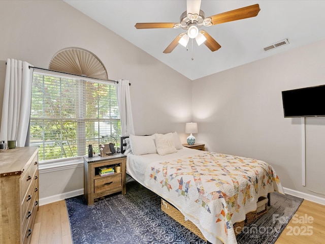 2214 Olde Chantilly Ct, Charlotte, NC 28205 - bedroom featuring lofted ceiling, multiple windows, wood finished floors, baseboards, and ceiling fan